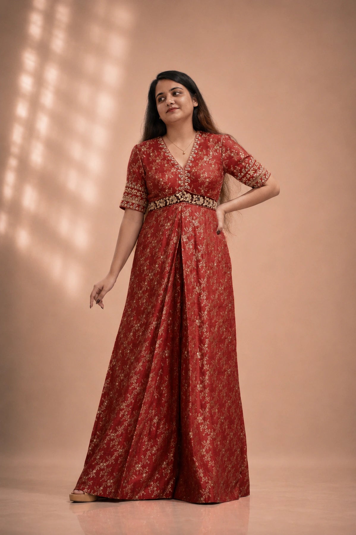 Red silk brocade jumpsuit with gold floral motif and embroidered sleeve cuffs, front view, occasion wear by Label Neha Sinha