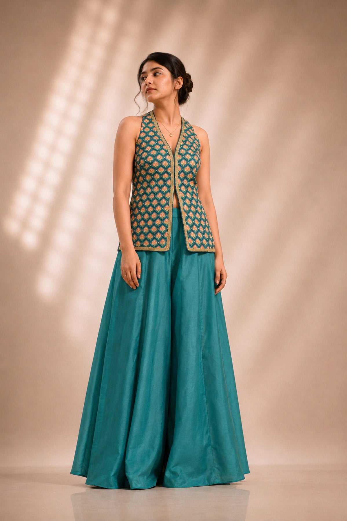 Peacock teal printed halter jacket and flared palazzo co-ord set, front view, occasion wear by Label Neha Sinha
